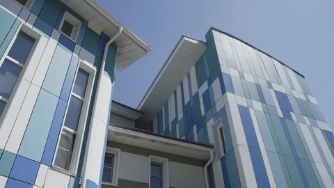 Conceptually new blue and white business center building in the city center Stock Footage 306146198