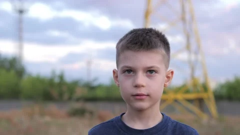 Concern for future generations and the environment. Boy puts on a helmet for an Stock Footage 138967329