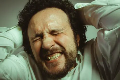 Concern for the future, man with intense expression, white shirt Stock Photos