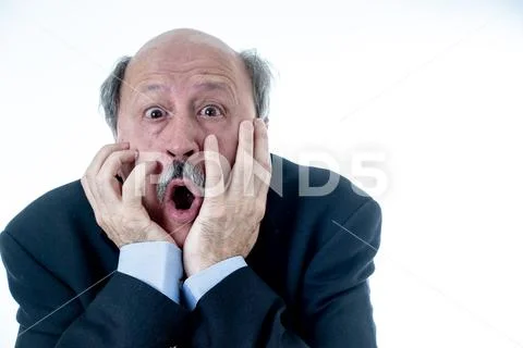 Concern scared shocked older adult man with a terrified facial expression Stock Photos
