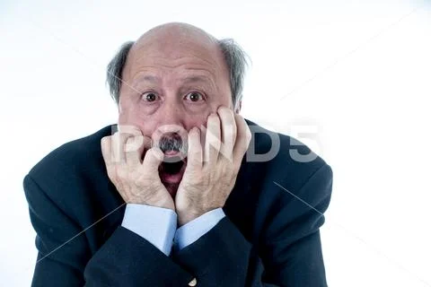 Concern scared shocked older adult man with a terrified facial expression Stock Photos