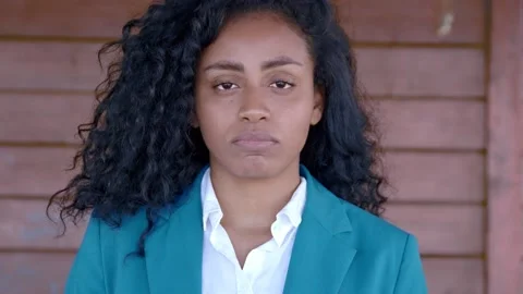 Concern, thoughts - pensive hispanic girl stares serious at camera Video stock 149485089
