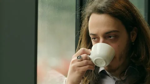 Concern, worry - man drinks a coffee while anxiously thinks about a problem Stock Footage 225457345