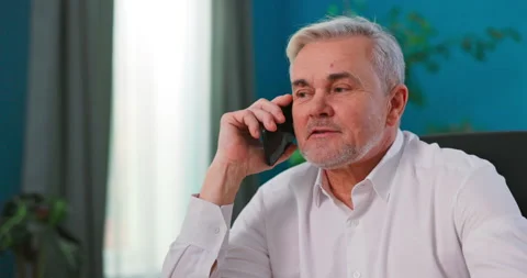 Concerned aged man hold smartphone use online consultation services talk to 库存影片 149860241
