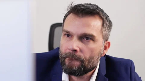 Concerned Businessman Looks at Computer Screen in Office, Stock Prices Stock Footage 139989019