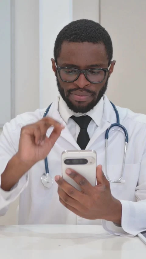 Concerned Doctor Using a Smartphone Stock Footage 317998021