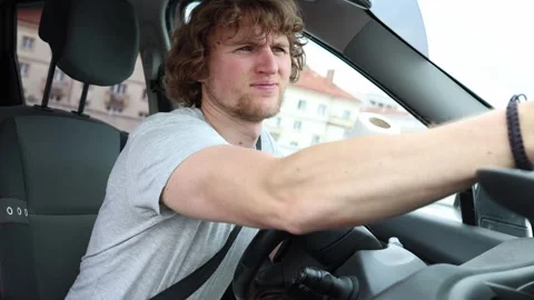 Concerned driver discovers a crack in his windshield before driving away Stock Footage 343720505
