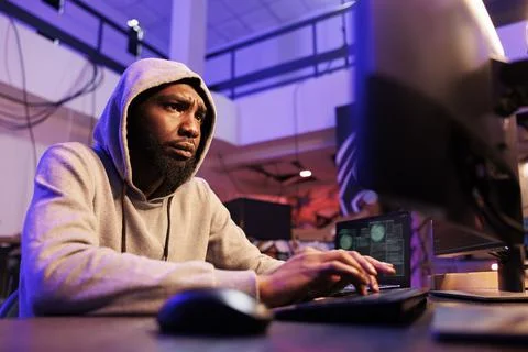 Concerned hacker cracking password Foto stock