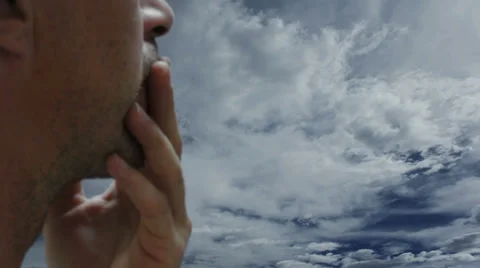 Concerned Man Against Timelapse Clouds Close Up Stock Footage 38104091