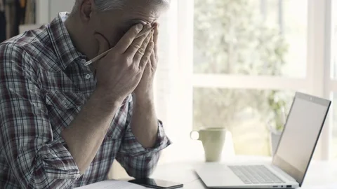Concerned man checking his home finances and debts Stock Footage 103203033