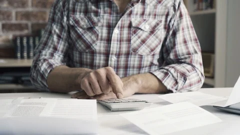 Concerned man checking his home finances and debts Stock Footage 103203183
