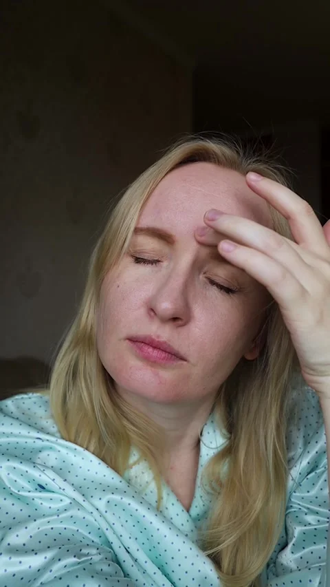Concerned middle aged woman touching forehead wrinkles and frown lines between e Vídeo Stock 343732798