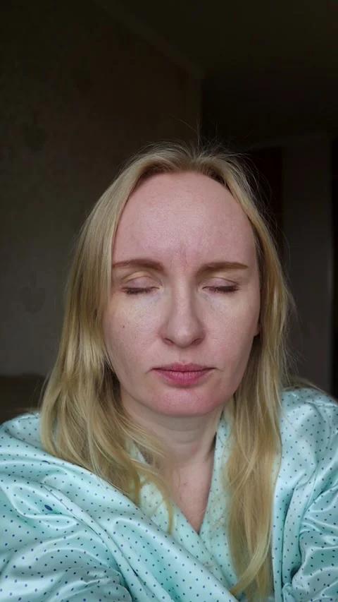 Concerned middle aged woman touching forehead wrinkles and frown lines between e Stock-Footage 343732900