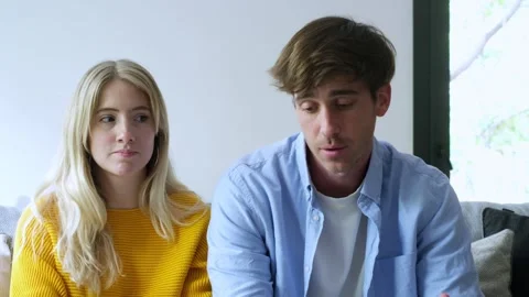 Concerned millennial couple talking and explaining their marital difficulties Video stock 345078480