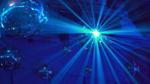 Concert light dynamic devices with disco balls Stockbeeldmateriaal 155940098