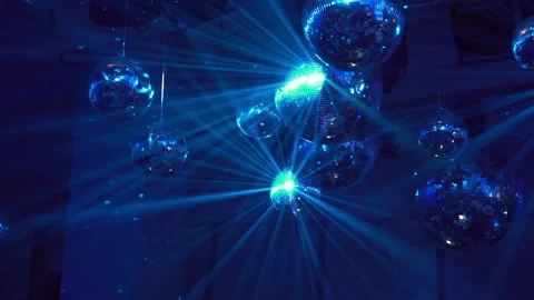 Concert light dynamic devices with disco balls Stockbeeldmateriaal 155940273