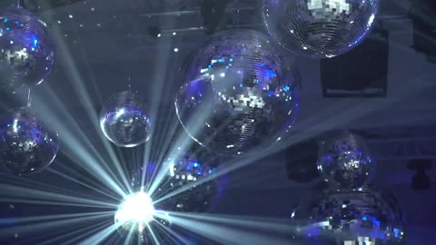 Concert light dynamic devices with disco balls Stockbeeldmateriaal 155940484