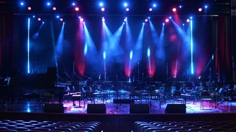 Concert light. Stage lighting background. A room and a stage without people. 스톡 동영상 221858619