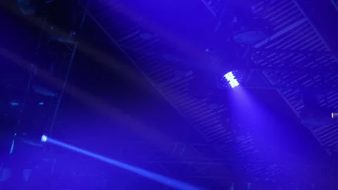 Concert lighting on a dark background, spotlights, blue flashing light. Stock Footage
