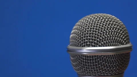 Concert microphone close-up on a blue background Stock-Footage 129882389