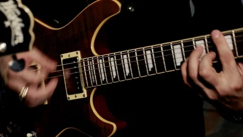 Concert rock band performing on stage with guitar. Music metal or rock group. Video stock 89140553