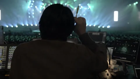 A concert technician managing a light Stock Footage 274001589