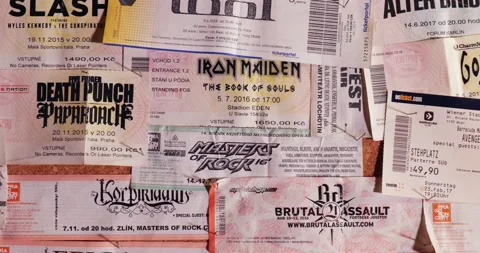 Concert tickets on a wall, rock and metal music Stock Footage