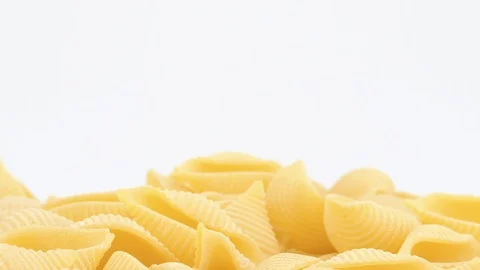 Conchiglie pasta rotating on white background, copy-space (loopable). 4K UHD Stock-Footage 92662595