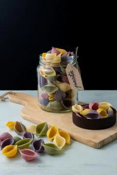 Conchiglie paste of different colors Stock Photos