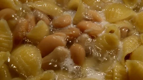Conchiglie rigate pasta with white beans Stock Footage 314586779