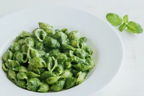 Conchiglie with spinach Stock Photos