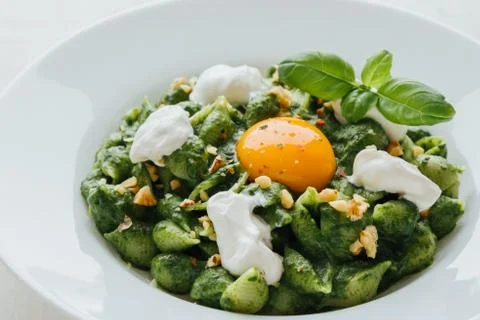 Conchiglie with spinach Stock Photos