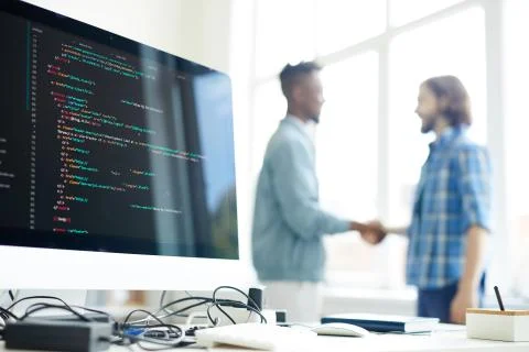 Concluding deal with coding company Stock-Fotos