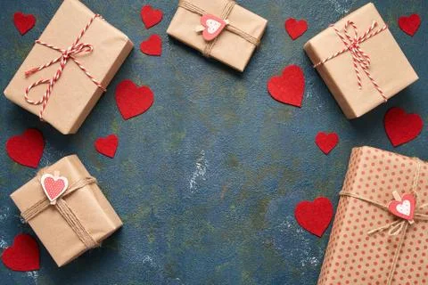Concrete background with copy space, presents and hearts for Valentine's day or Stock Photos