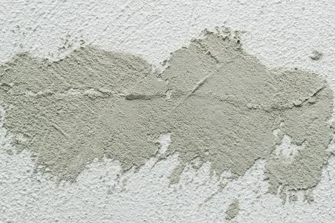 Concrete background. Plaster on the wall. Embossed textured surface. Stock Photos