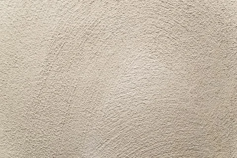 Concrete background. Plaster on the wall. Embossed textured surface. Stock Photos