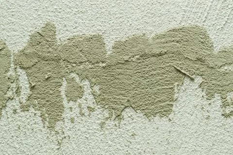 Concrete background. Plaster on the wall. Embossed textured surface. Stock Photos