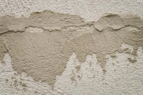 Concrete background. Plaster on the wall. Embossed textured surface. Stock Photos