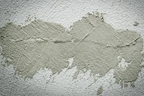 Concrete background. Plaster on the wall. Embossed textured surface. Stock Photos