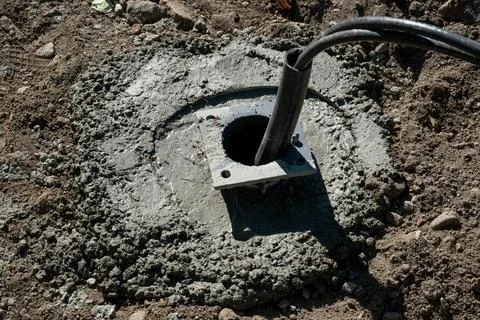 Concrete Base with Cable on Construction Site Stock Photos