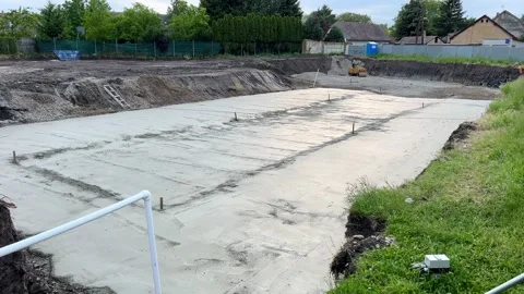 Concrete base, cement foundation at building construction site Stock Footage 241109981