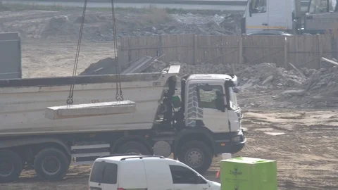 The concrete beam is moved by a crane. construction site. Stock Footage 120674714