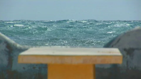 Concrete bench at the ocean Stock Footage 94609