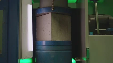 Concrete block breaks under high pressure . Compressive strength test Stock Footage 153045361