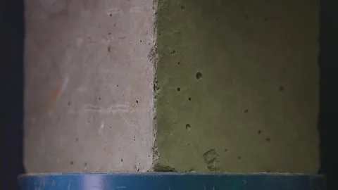 Concrete block breaks under high pressure . Compressive strength test Stock Footage 153052015