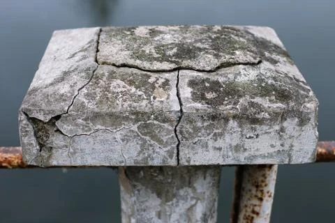 Concrete block with deep cracks Stock Photos