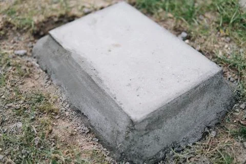 Concrete block embeded on a ground Stock Photos