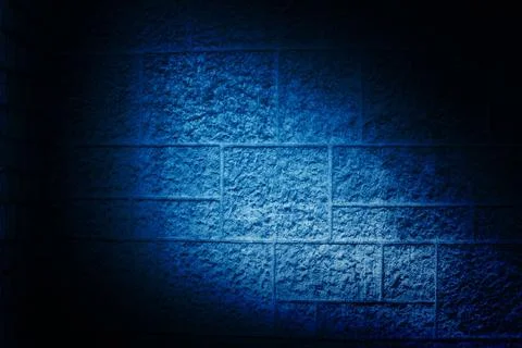 Concrete block wall is being shown in flat design, with blue spotlight beam Stockfoto's