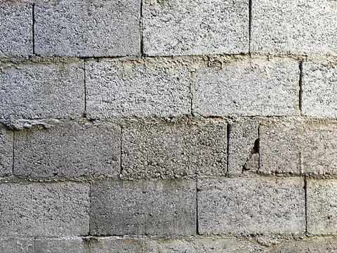 Concrete block wall of a construction in progress for photographic background Stock Photos
