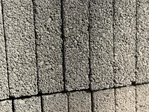 Concrete blocks stacked in pattern, ideal for construction and architecture.. Stock Photos